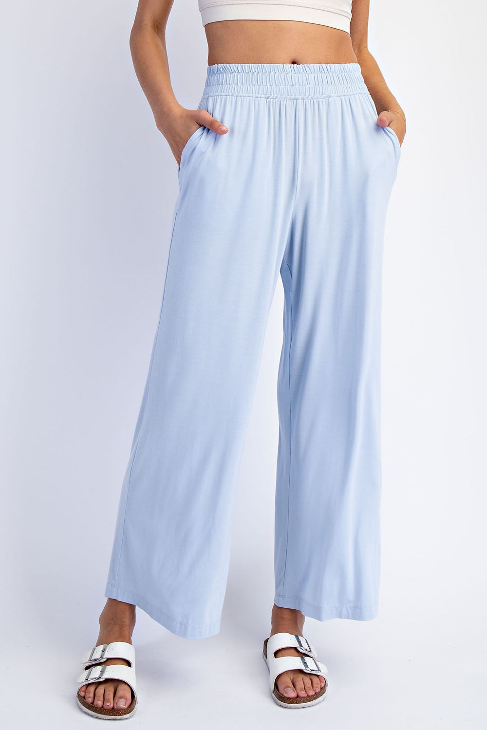 woman wearing light blue wide-leg pants with an elastic waistband and side pockets