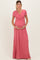 woman wearing a pink short sleeve maternity maxi dress and holding her baby bump