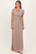 woman wearing a dusty rose short sleeve maxi dress with a wrap design and gathered waistline