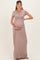 woman wearing a taupe short sleeve maternity maxi dress and holding her baby bump
