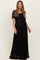woman wearing a black lace maternity maxi dress with a tie waist and short sleeves, showcasing her baby bump