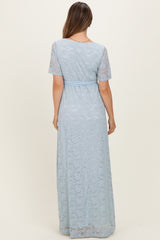 maternity wear light blue lace maxi dress with short sleeves and a fitted waist, shown from the back