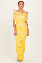 woman wearing a off-the-shoulder yellow ruched bodycon dress with a fitted silhouette