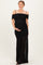 woman wearing a black off-shoulder maternity dress with ruched detailing and a sheer skirt, showing her baby bump