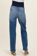 woman wearing blue maternity jeans viewed from the back, featuring a relaxed fit and pockets