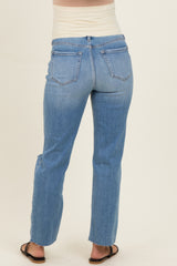 woman wearing light blue maternity jeans with a straight leg cut, showing the back view