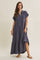 woman wearing a navy blue button-up maxi dress with short sleeves and tiered detailing