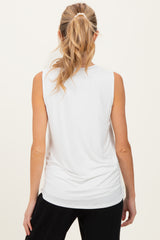 woman wearing a white sleeveless maternity top, shown from the back