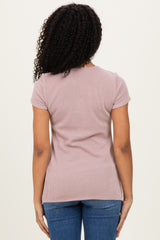 woman wearing a light pink ribbed short sleeve top from the back with fitted silhouette