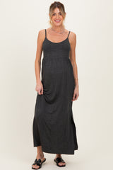 woman wearing a black and gray striped maternity maxi dress with spaghetti straps and a relaxed fit