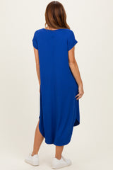 woman wearing a blue ribbed midi dress with short sleeves and a relaxed fit, shown from the back