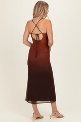 woman wearing a brown ombre midi dress with a strappy back and tied detail, styled with strappy sandals