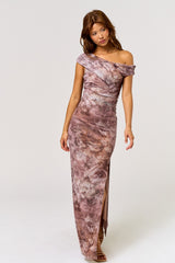 woman wearing a floral off-the-shoulder maxi dress with a thigh-high slit and ruched details