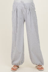 maternity wear striped wide-leg pants with a drawstring waist and pockets, model wearing sandals