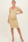 woman wearing a yellow polka dot maternity dress with short puff sleeves and gathered sides, highlighting her baby bump