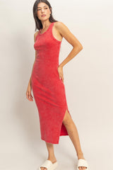 woman wearing a red ribbed midi dress with side slits and a scoop neckline