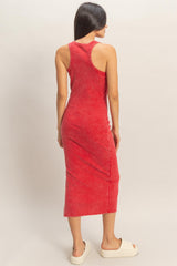 woman wearing a red sleeveless midi dress with a relaxed fit, seen from the back