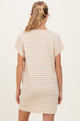 woman wearing a striped maternity dress with short sleeves, showing the back view