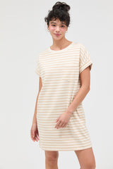 woman wearing a cream and beige striped t-shirt dress with a pocket and rolled sleeves