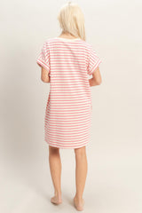 woman wearing a pink and white striped short sleeve nightshirt, seen from the back