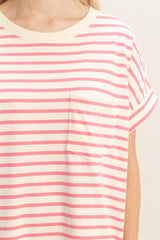 woman wearing a pink and cream striped t-shirt with a pocket on the chest