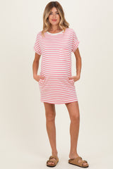 woman wearing a pink and white striped maternity dress with short sleeves and pockets