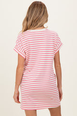 woman wearing a pink and white striped maternity t-shirt dress, view from the back