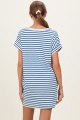 woman wearing a navy and white striped maternity dress with short sleeves, showing the back view