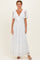 woman wearing a white lace maxi dress with a deep V-neck and short flutter sleeves