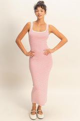 woman wearing a fitted red and white striped maxi dress with thin straps and a scoop neckline
