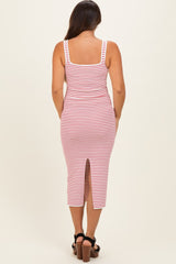 woman wearing a red and white striped maternity midi dress with a back slit, showing a baby bump