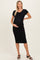 woman wearing a black ribbed maternity midi dress and showing her baby bump