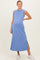 woman wearing a light blue sleeveless maternity maxi dress with side slits and a baby bump visible