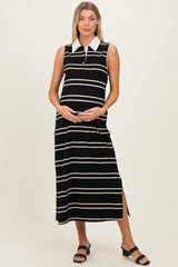woman wearing a black and white striped maternity maxi dress with a collar and side slit, holding her baby bump