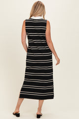 woman wearing a black and white striped sleeveless maxi dress, view from the back