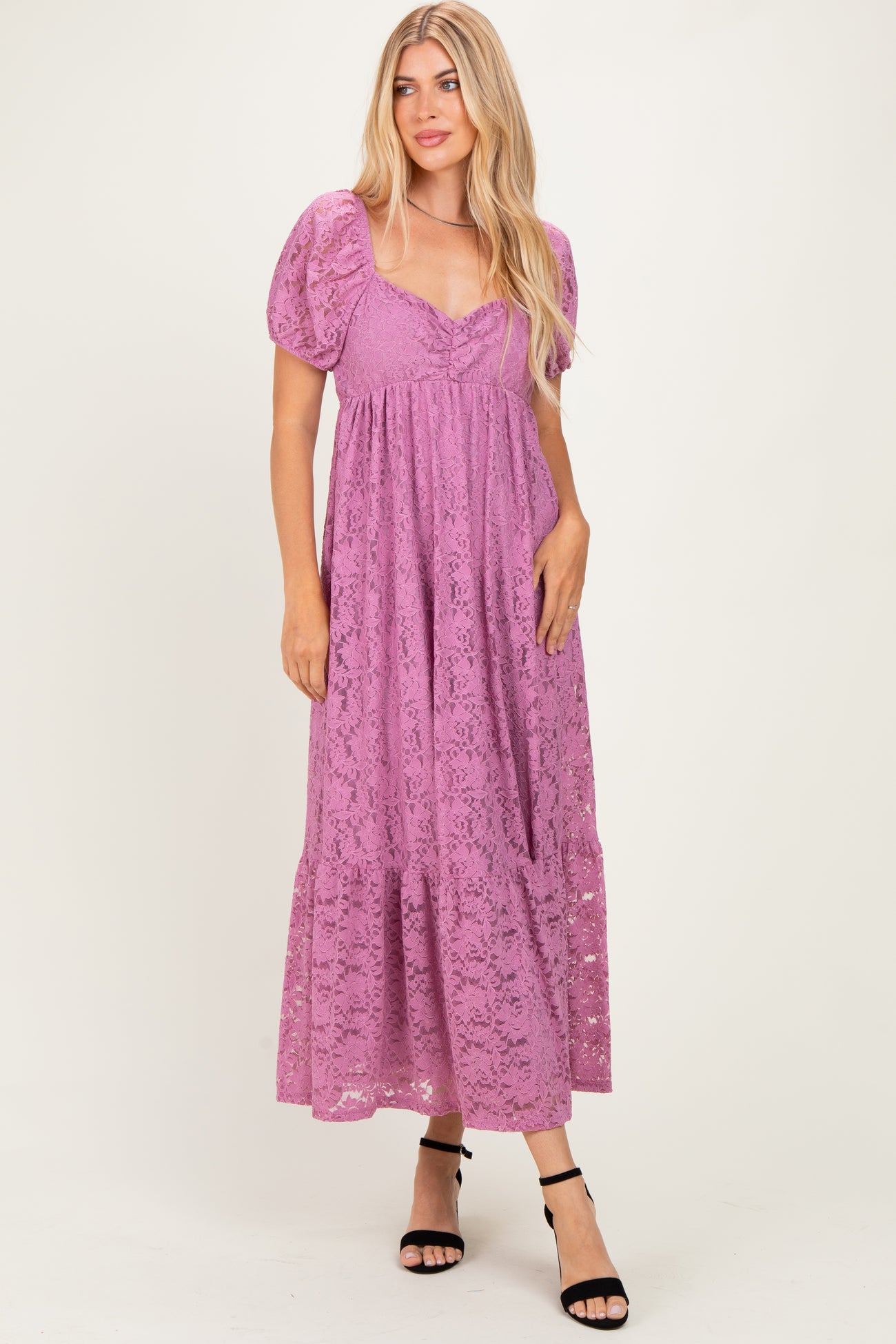 woman wearing a lilac lace maxi dress with puff sleeves and a v-neckline