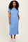 woman wearing a blue short sleeve maxi dress with a pocket and side slits