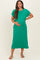 woman wearing a green short sleeve maternity dress with a pocket and holding her baby bump