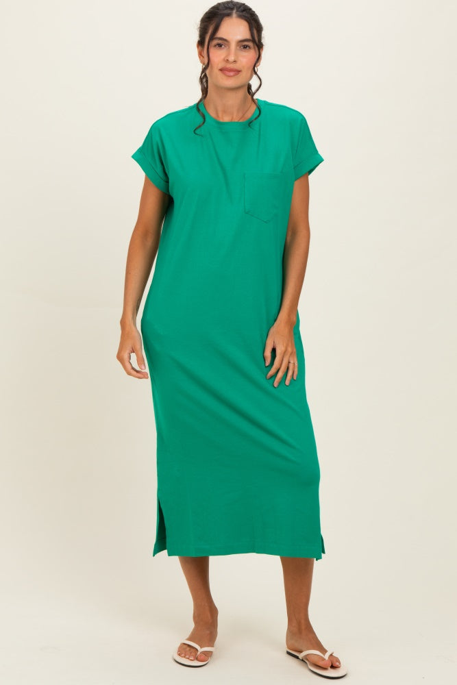 woman wearing a green short sleeve maxi dress with a pocket and side slits