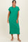 woman wearing a green short sleeve maxi dress with a pocket and side slits