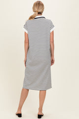 woman wearing a navy and white striped short sleeve dress, view of the back