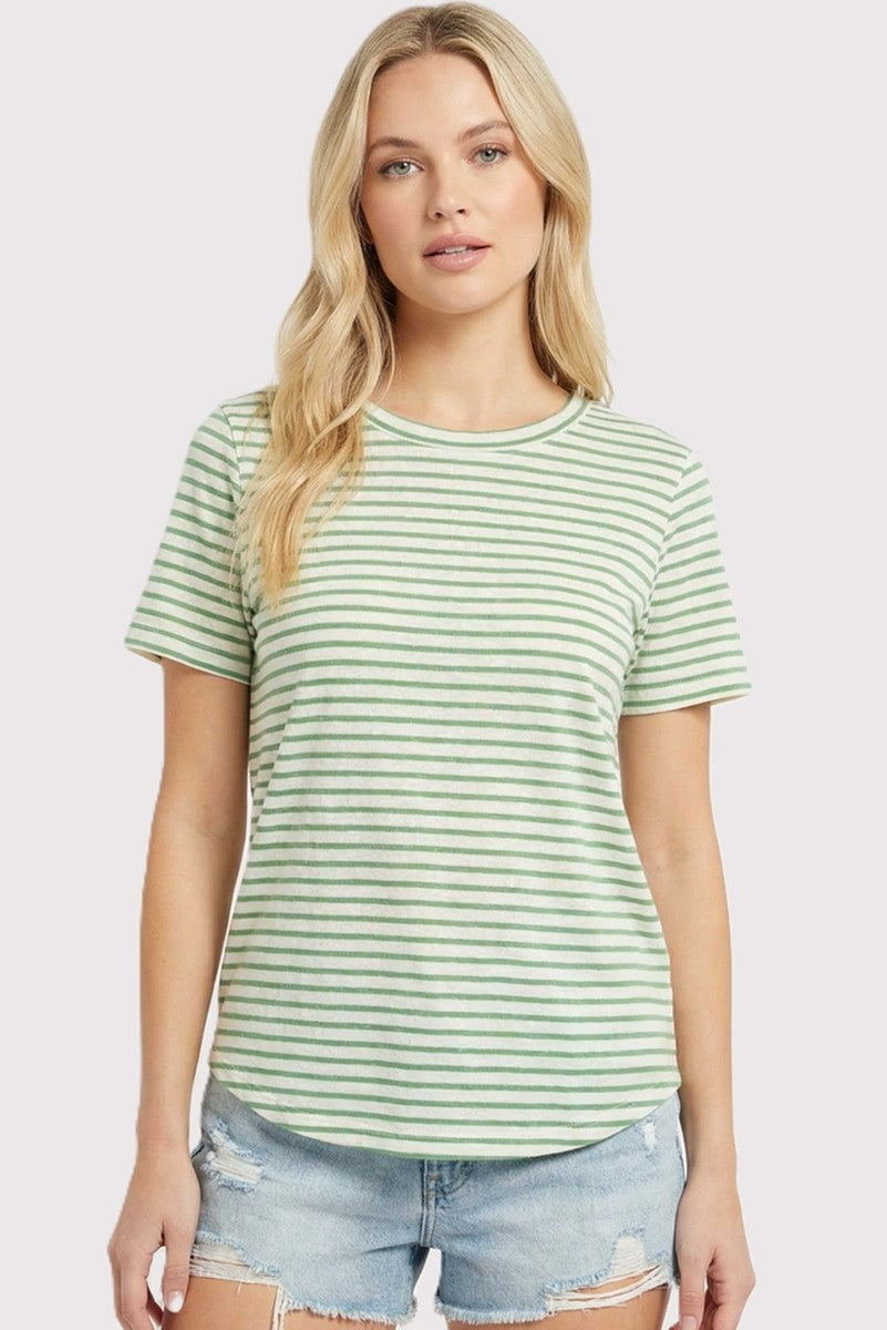woman wearing a green and white striped short sleeve t-shirt and distressed denim shorts