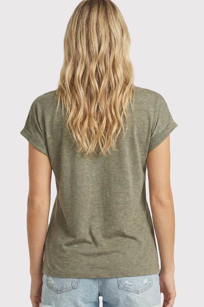 woman wearing a short sleeve olive green top with rolled cuffs and relaxed fit
