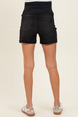 woman wearing black maternity shorts with a stretchy waist panel, showing the back view