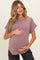 woman wearing a mauve short sleeve maternity top and holding her baby bump