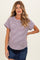 woman wearing a maternity striped short sleeve top with a round neckline and a relaxed fit