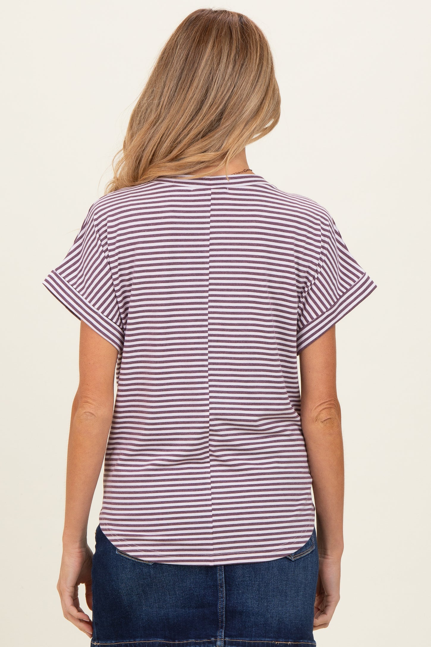 woman wearing a striped maternity top with short sleeves and a scoop back design