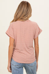 woman wearing a rust and white striped maternity top with short sleeves and a relaxed fit, viewed from the back
