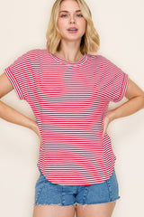 woman wearing a red and white striped short sleeve top and blue denim shorts
