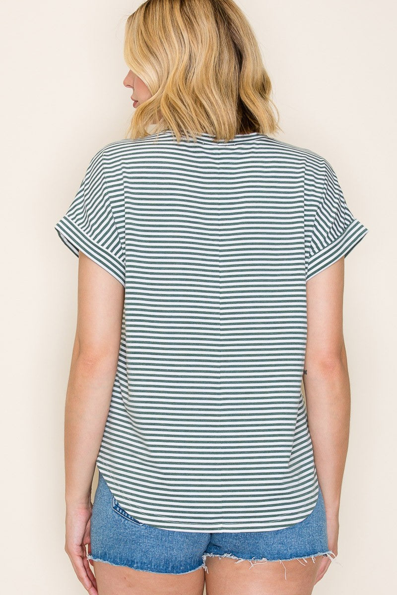 woman wearing a striped short sleeve top with rolled cuffs and denim shorts, shown from the back